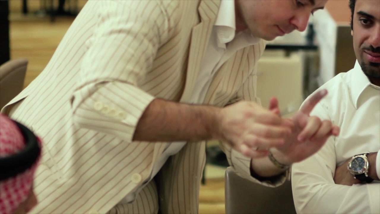 Fred Sharp performing close-up magic for guests